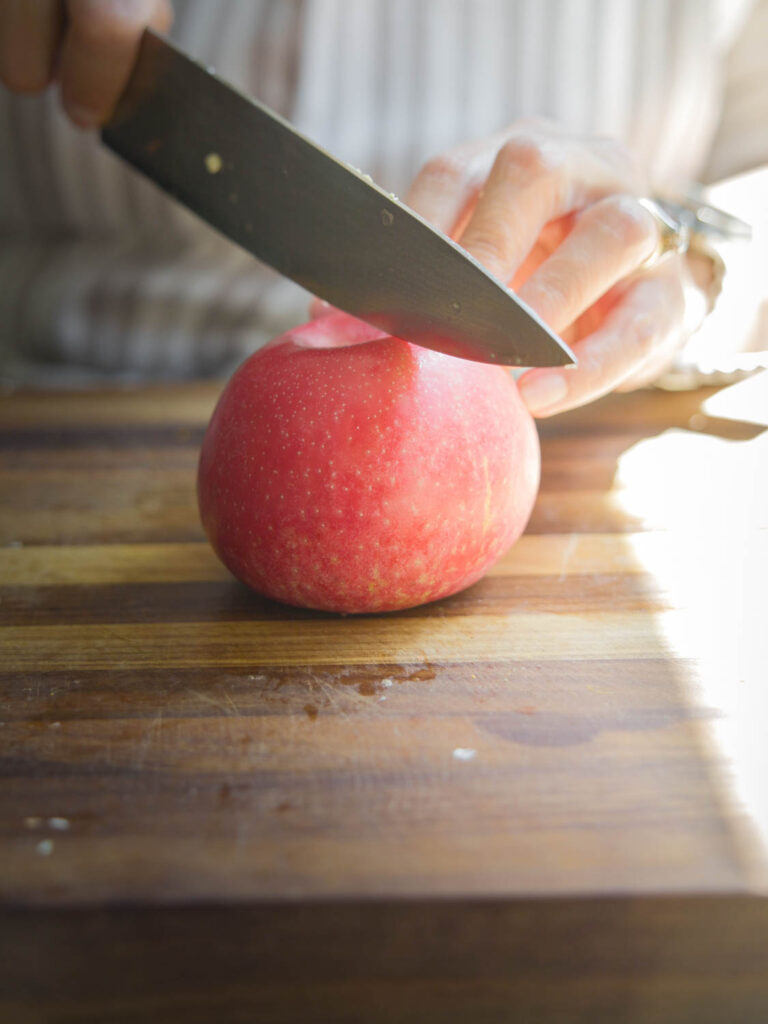 cutting red apple